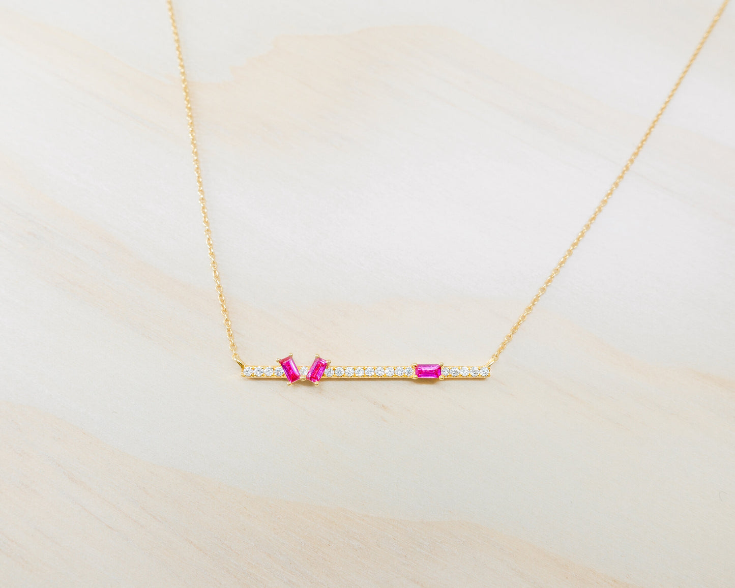 "Aurora" baguette cut ruby with diamond bar necklace