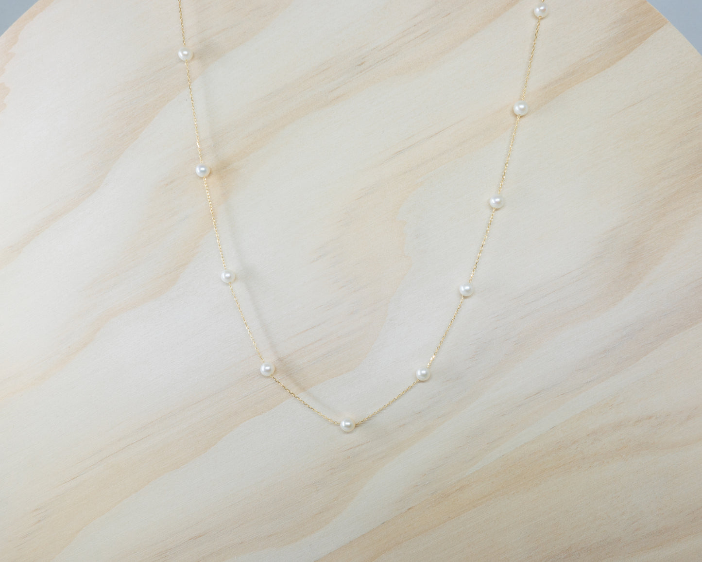 Floating petite pearl necklace